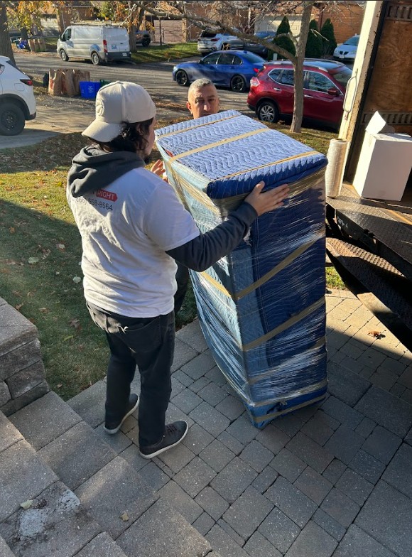 Move It Right movers wrapping and packing furniture for a spring relocation in the GTA