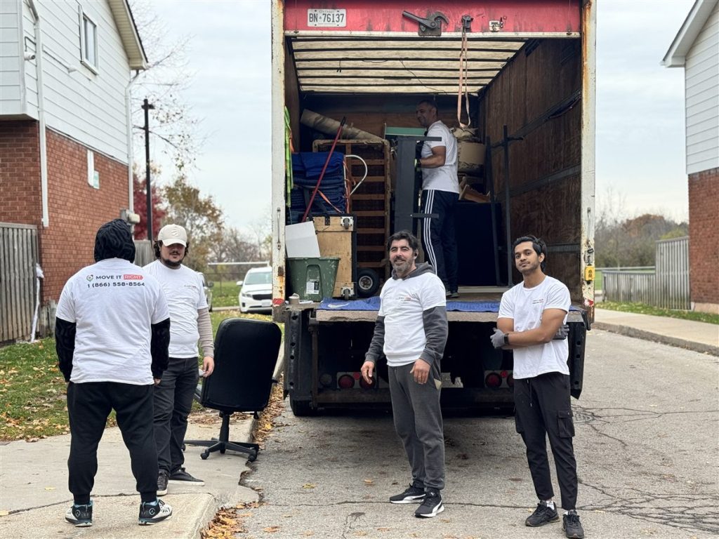 Move It Right crew standing by moving truck in GTA neighbourhood during spring relocation